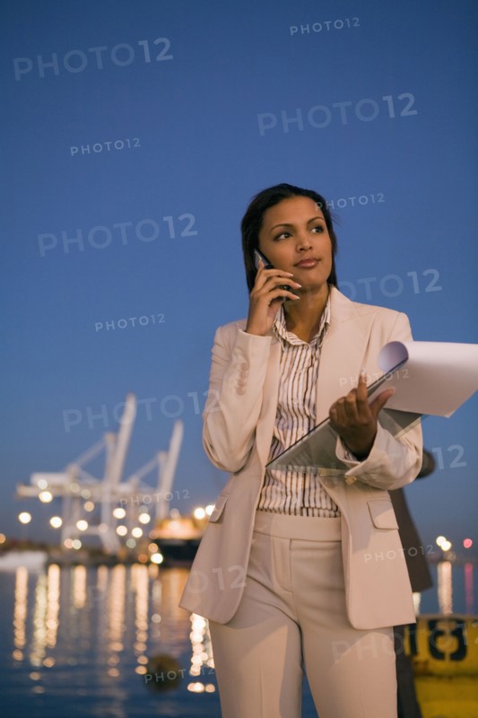 African American businesswoman talking on cell phone