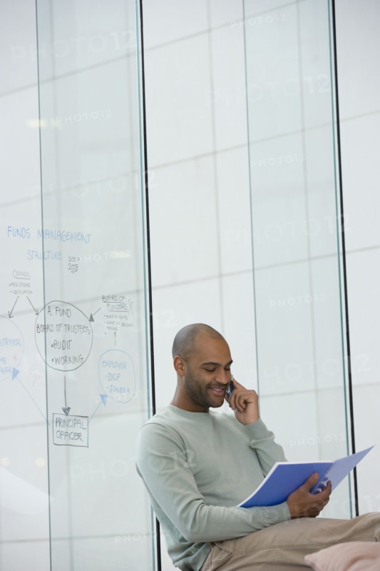 African businessman talking on cell phone