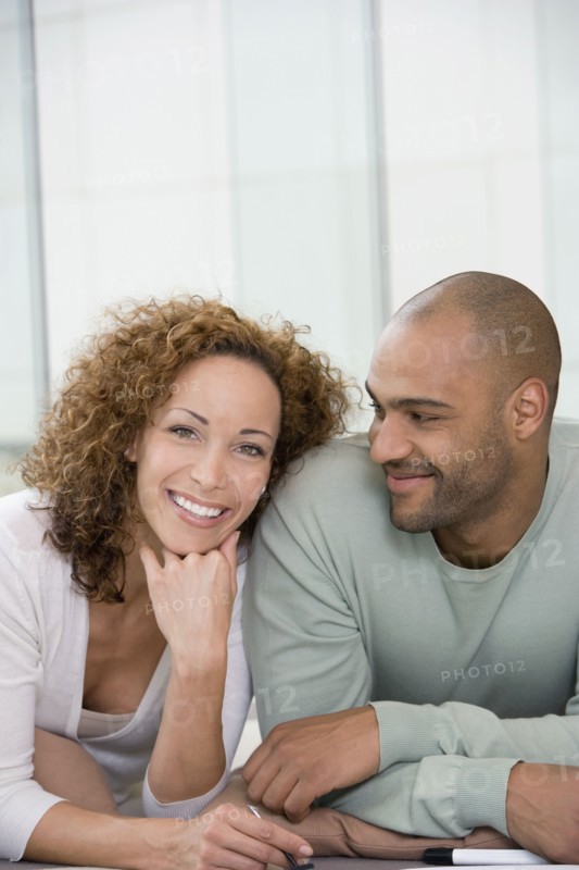African couple laying on floor