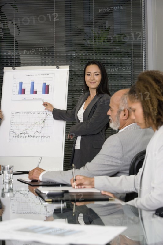 Asian businesswoman giving presentation