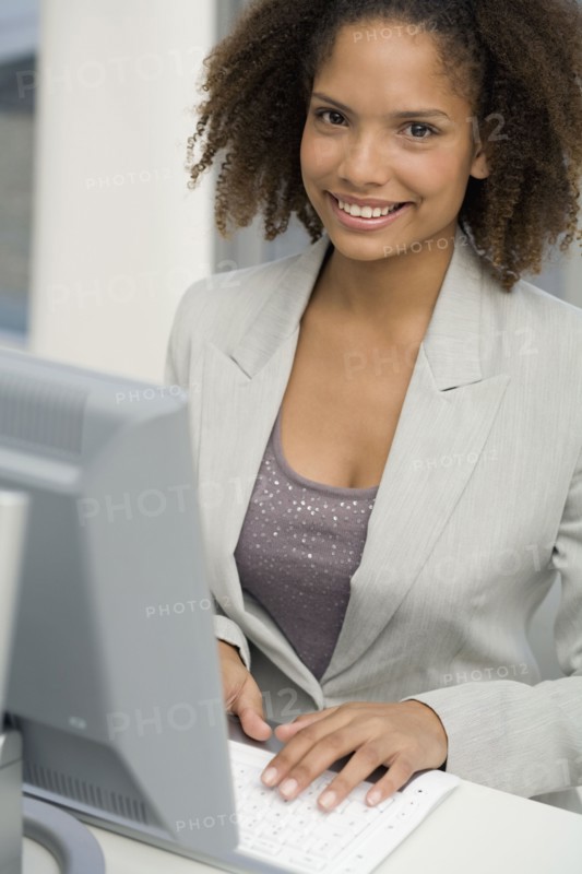 African businesswoman typing on computer