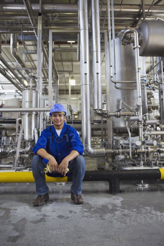 African worker sitting in factory