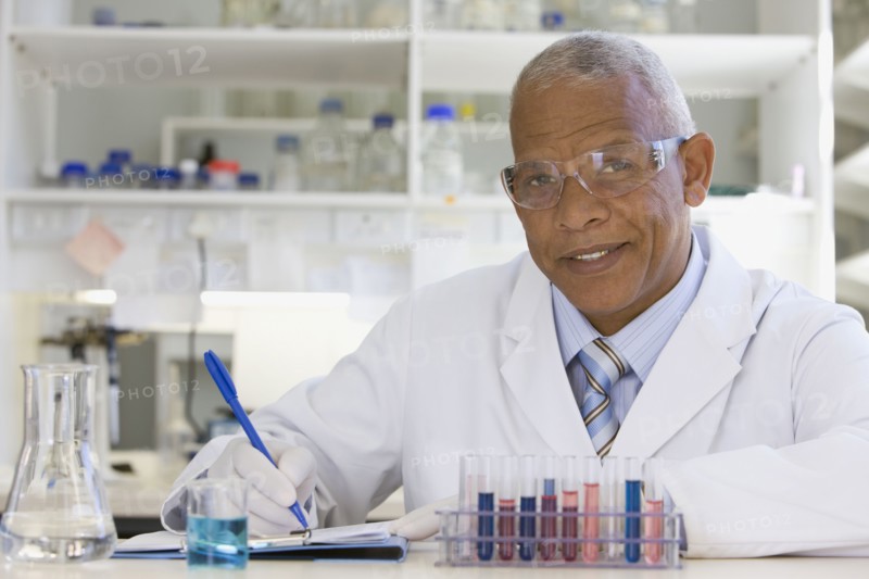 African scientist performing analysis in laboratory