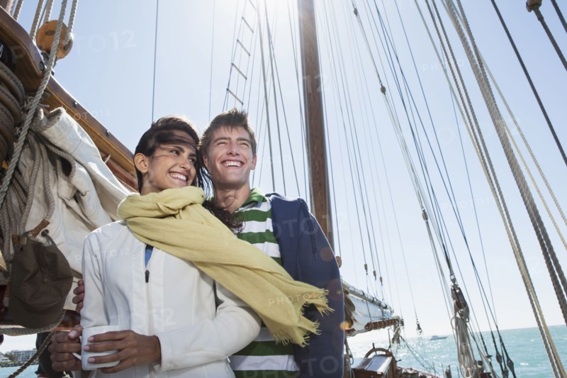 Caucasian couple on sailboat