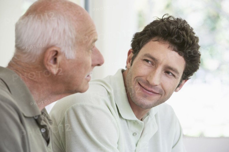 Caucasian father and son smiling