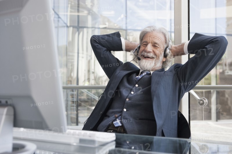 Senior Caucasian businessman talking on headset
