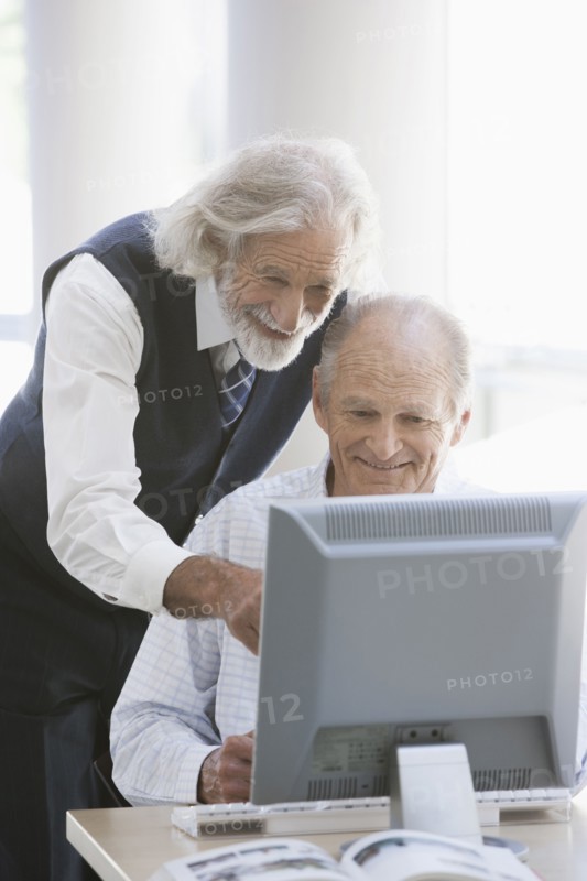 Senior Caucasian businessmen working together in office