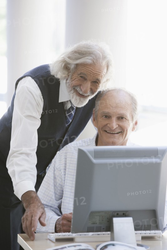 Senior Caucasian businessmen working together in office