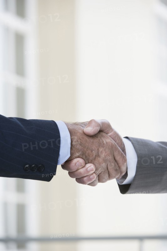 Caucasian businessmen shaking hands