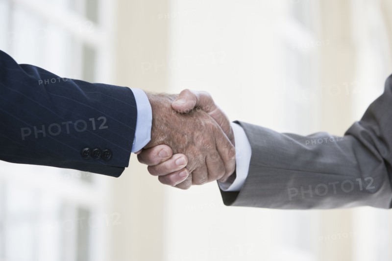 Caucasian businessmen shaking hands