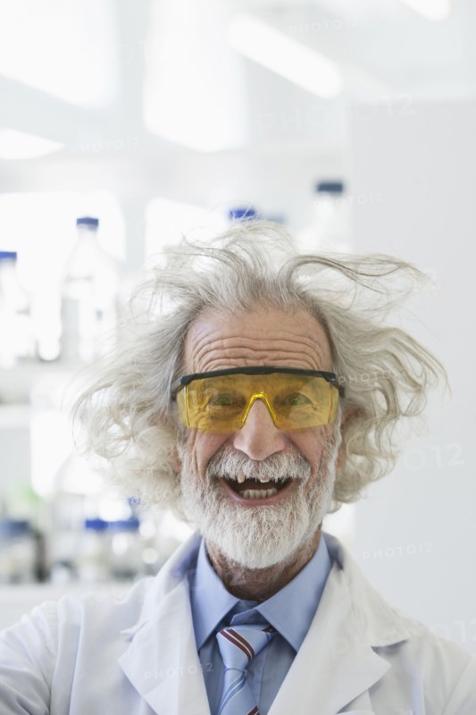 Senior Caucasian scientist with unruly hair in lab