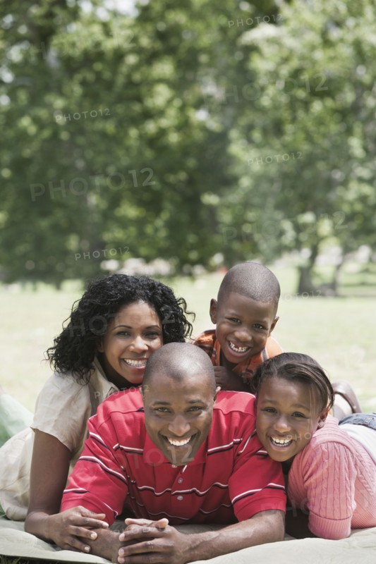Family relaxing together in park