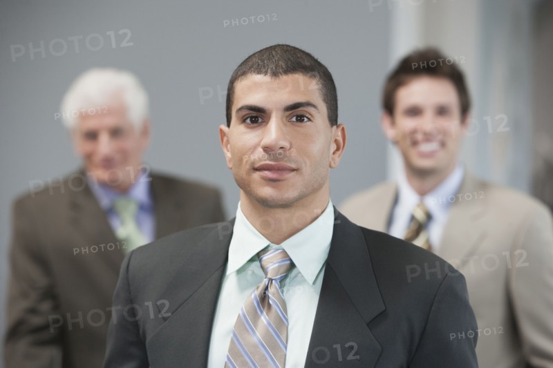 Businessmen standing in office