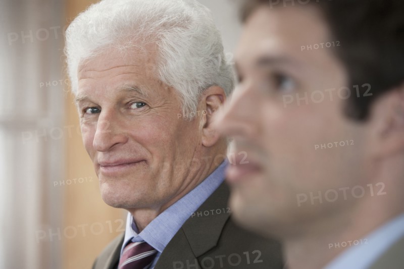 Businessmen standing in office