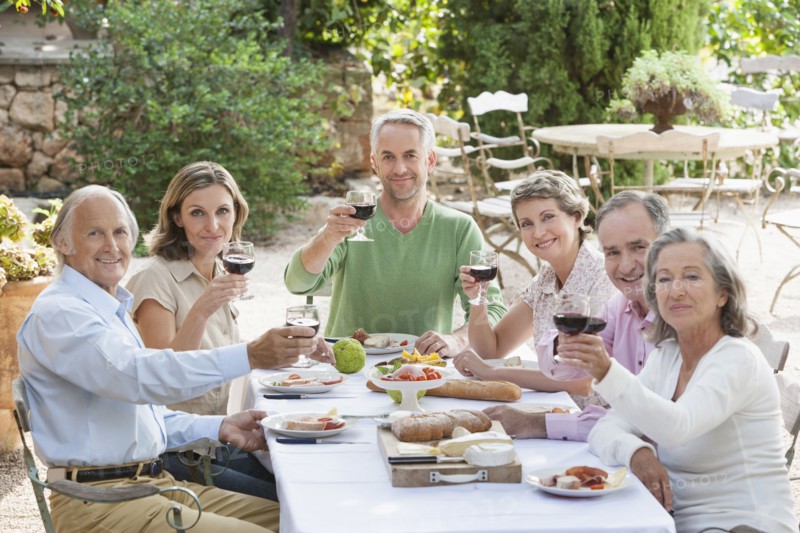 Friends eating together outdoors