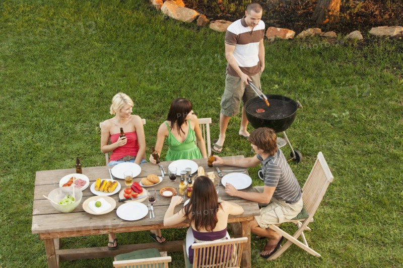 Friends eating together outdoors