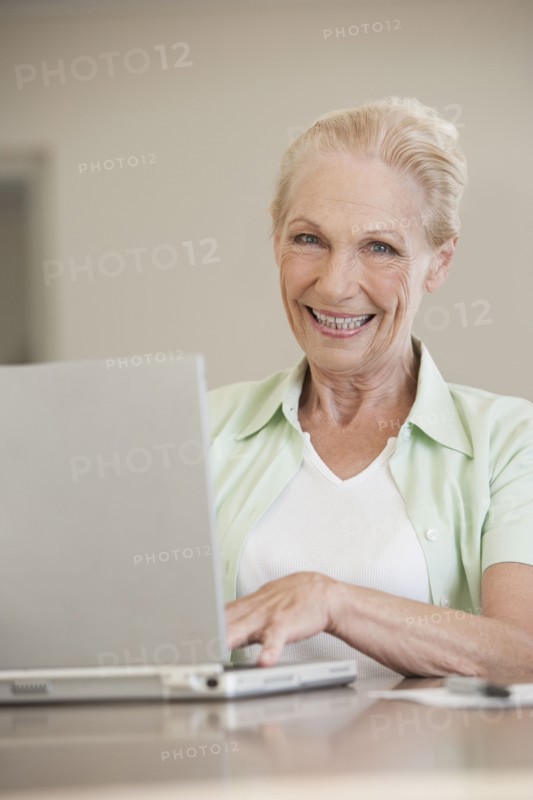 Senior Caucasian woman using laptop