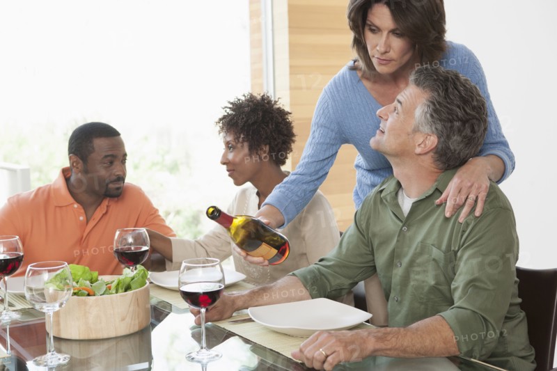 Friends having wine together at dinner