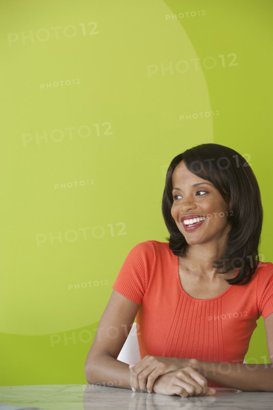 Smiling woman sitting at table
