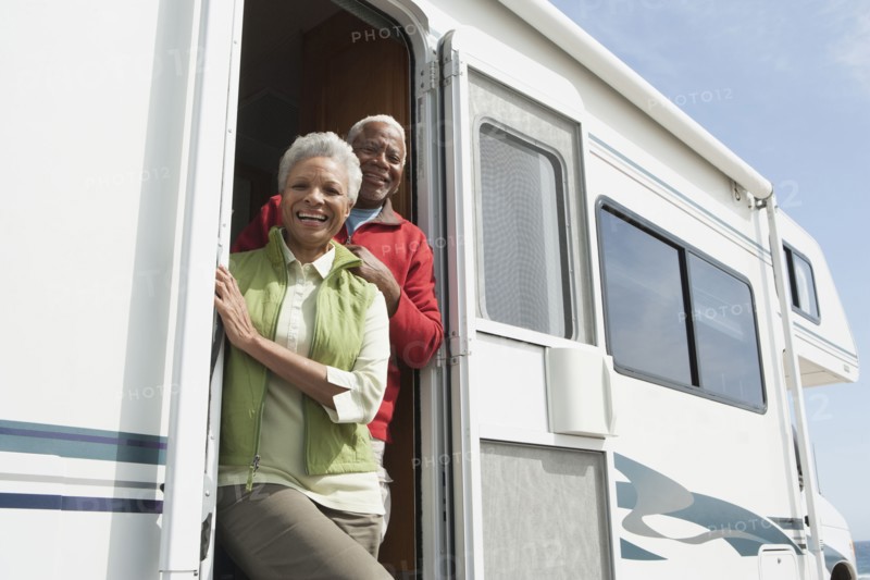Mixed race Senior couple smiling in RV