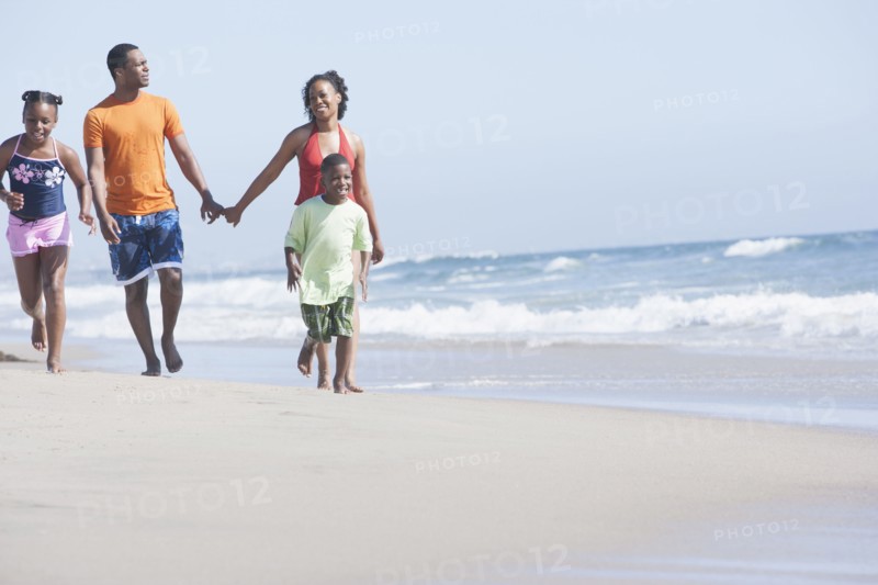 Family walking together on beach
