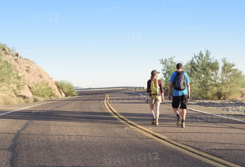 Couple hiking on winding street