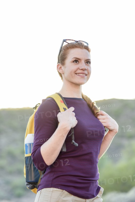 Caucasian hiker wearing backpack
