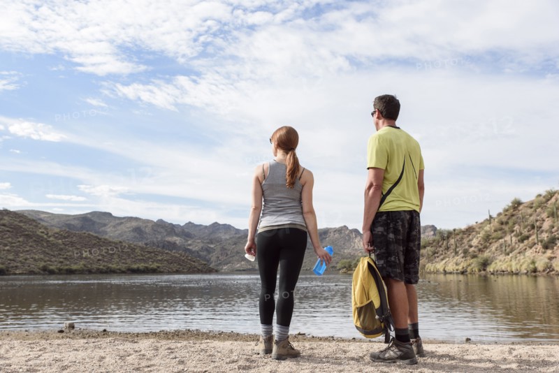 Hikers resting at lake