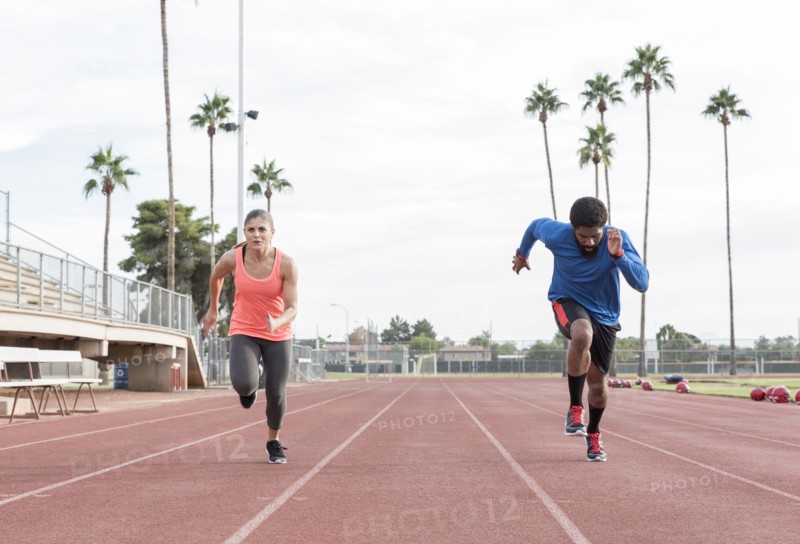 Man and woman running on track