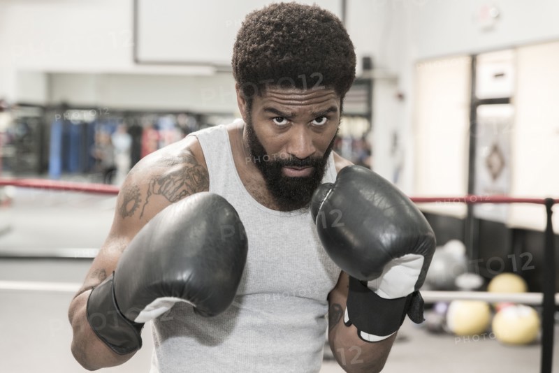 Black man posing in boxing ring