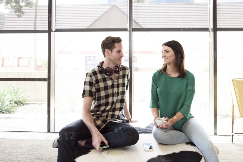 Caucasian couple relaxing on bench