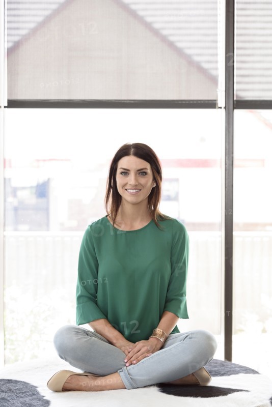 Portrait of smiling Caucasian woman sitting on bench