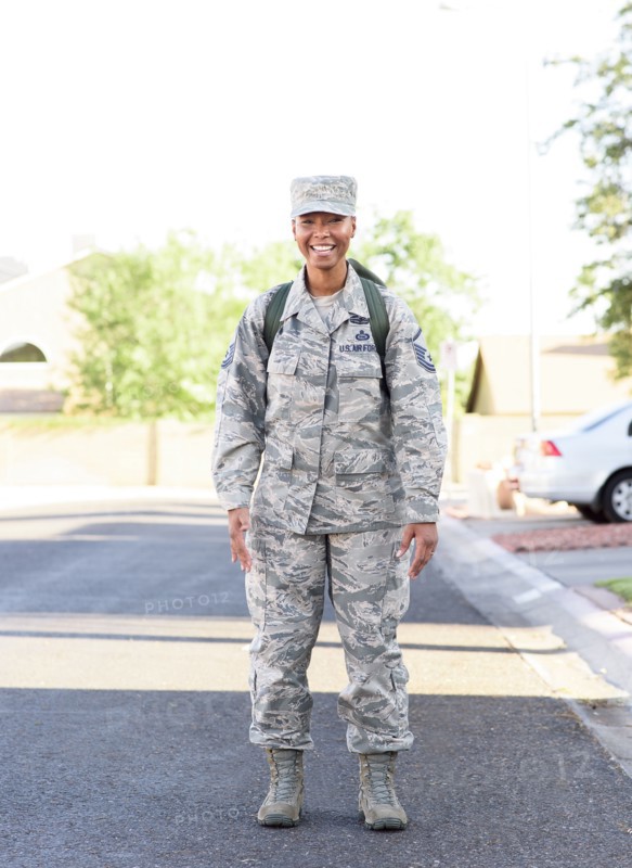 Portrait of black woman soldier standing in street