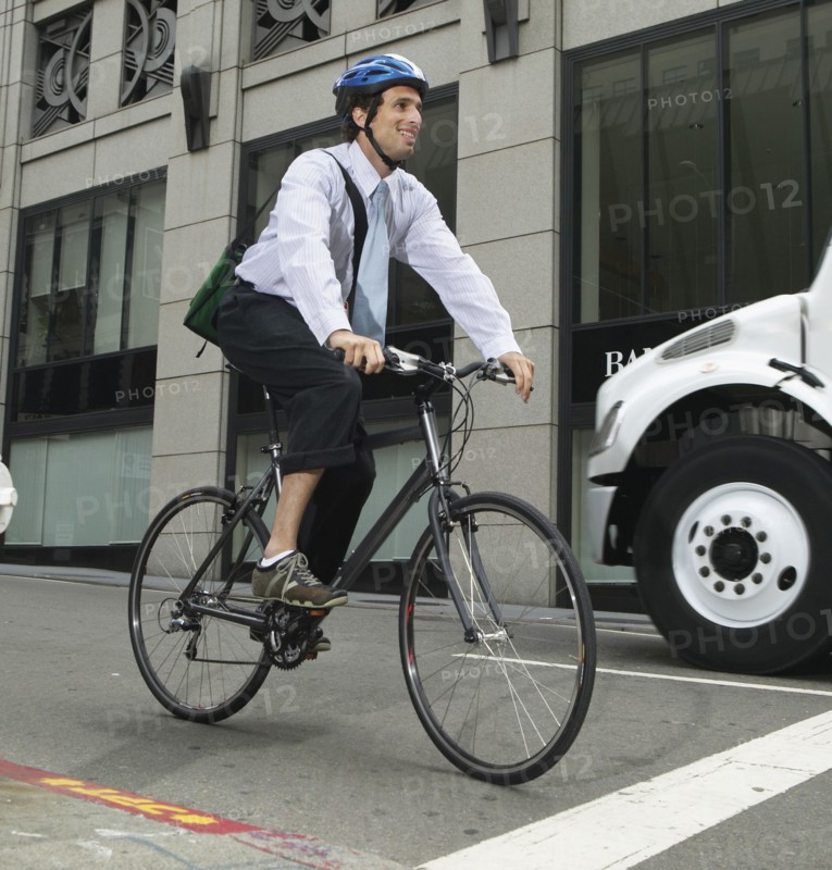 Businessman commuting on bike