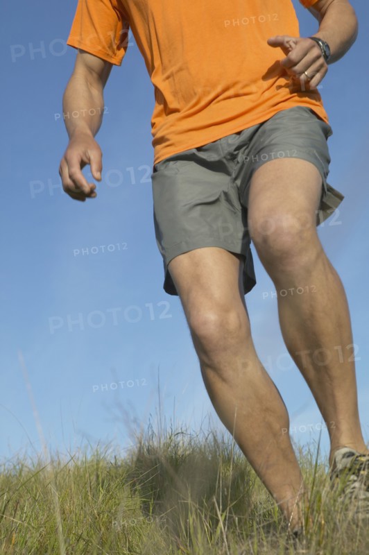 Man walking through grass