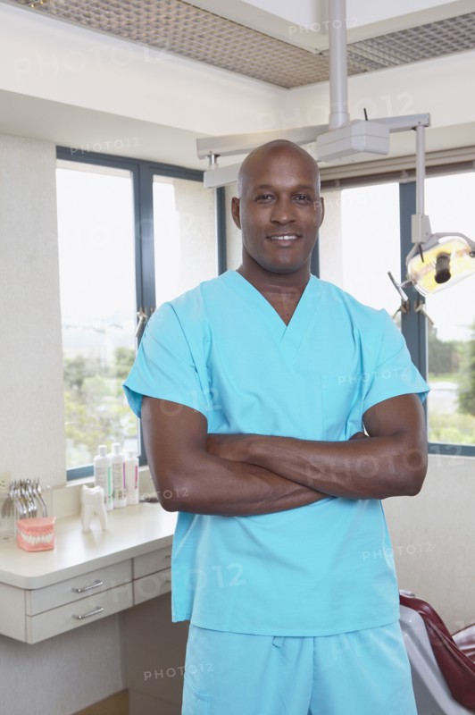African male dental assistant in office
