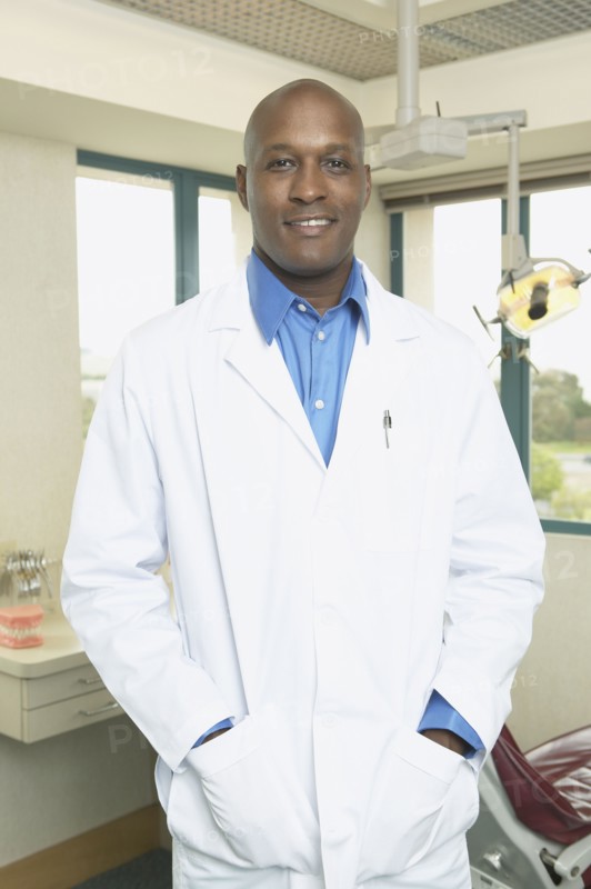 African male dentist in office