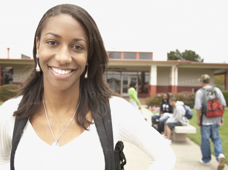 Young African woman smiling on school campus