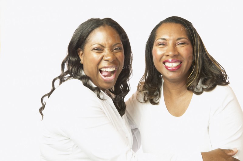 Adult African sisters laughing