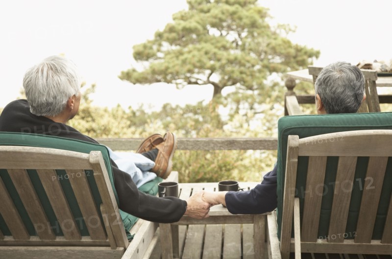 Senior couple holding hands outdoors