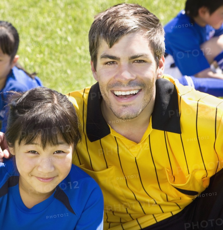 Portrait of Asian girl and soccer coach