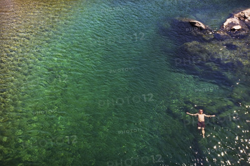 Caucasian man swimming in ocean