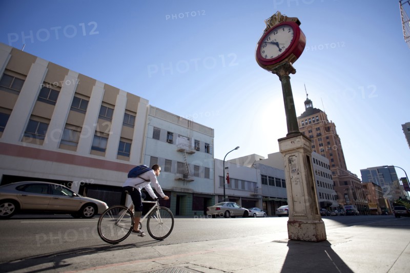 Bicycle messenger riding on city street