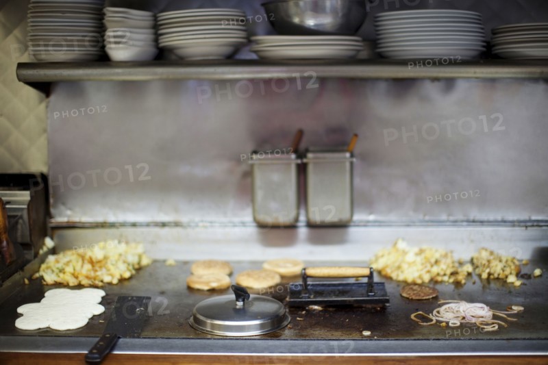 Breakfast cooking on diner griddle