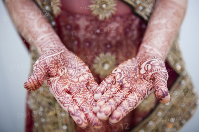 Caucasian woman with Indian henna tattoos on her hands