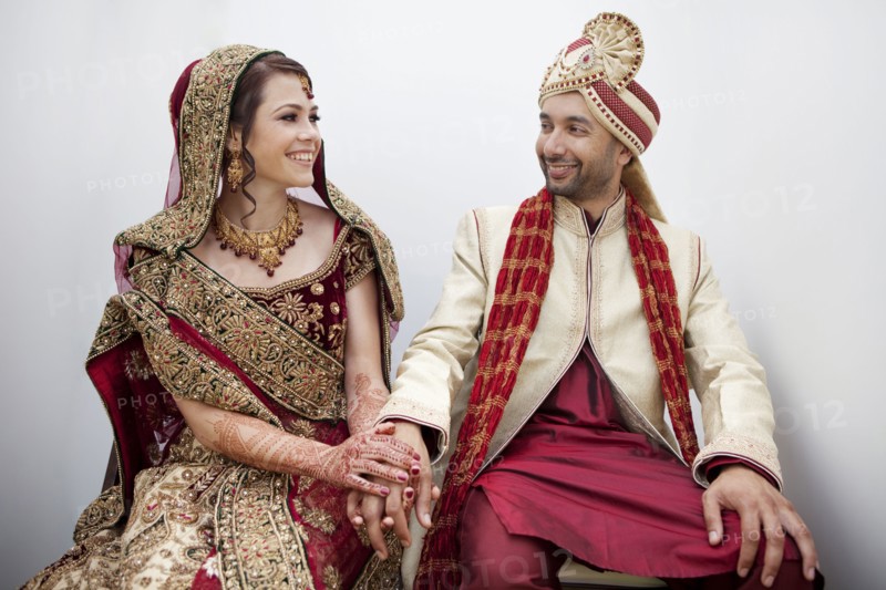 Bride and groom in traditional Indian wedding clothing