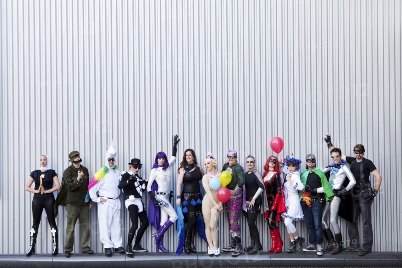 People dressed in superhero costumers