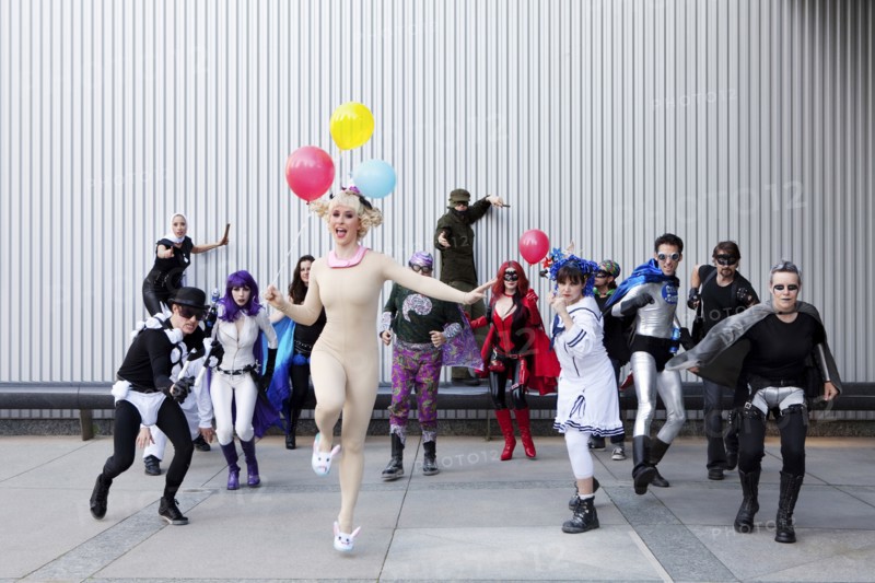 People dressed in superhero costumers