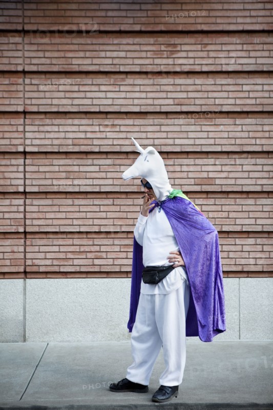 Caucasian man in unicorn costume