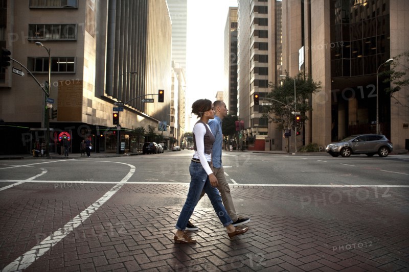 Couple crossing city street